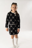 Conj. Falda tricot jacquard lazos negro